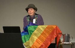 Mani Mitchell presenting at LGBTTI symposium